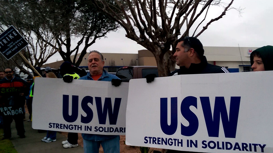 PHOTO: Members of United Steelworker’s International and supporters picket at the Marathon Oil office in Texas City, Texas. USW initiated a work stoppage on Feb. 1, 2015, as contract negotiations with major U.S. oil producers ground to a halt. Photo courtesy of Geoffrey Lauren Bruder