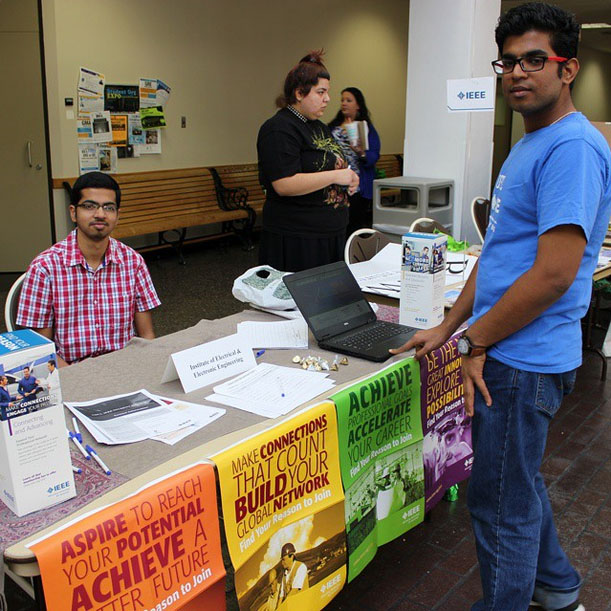 Photo: Raghavendran Ramesh, computer science major and member of the Institute of Electrical and Electronic Engineering Organization, recruits Srinath Mohanram, computer engineering major, at the 2015 Student Org Expo. Photo by The Signal reporter Raj Sheth.