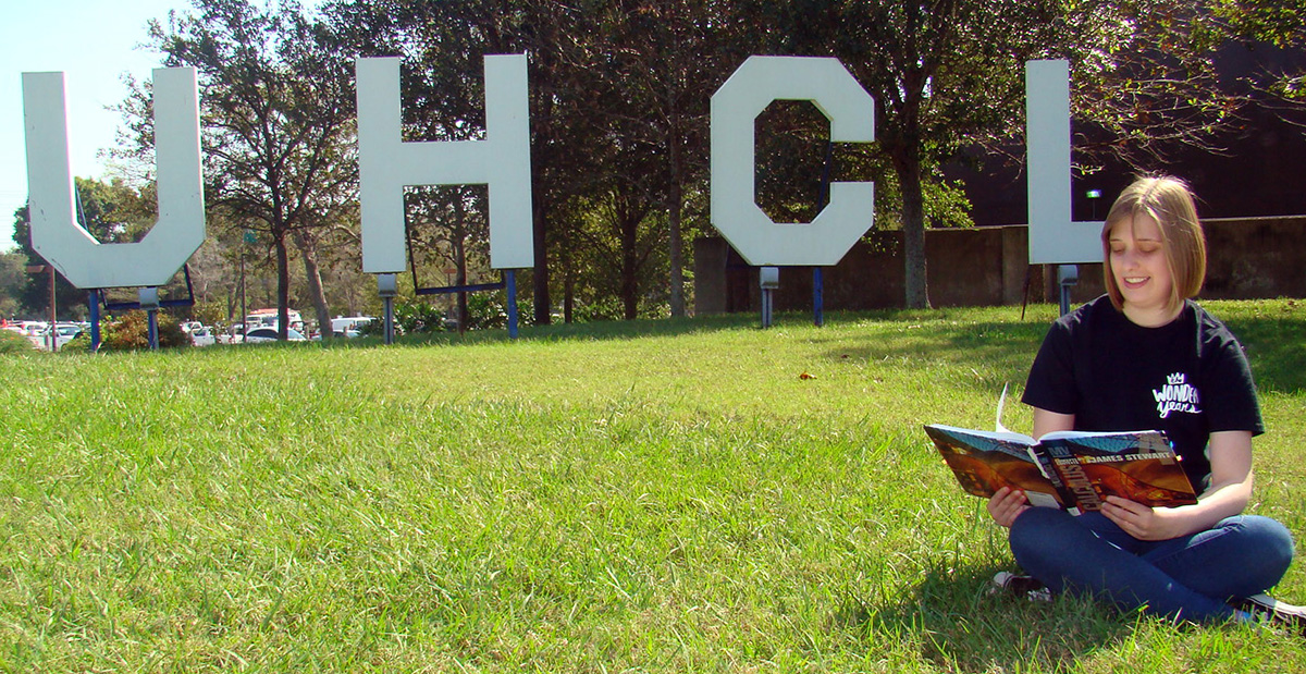 Image: Brandi Rygaard, math major, studying for calculus by the UHCL letters. Photo by The Signal reporter Kyle Upton.