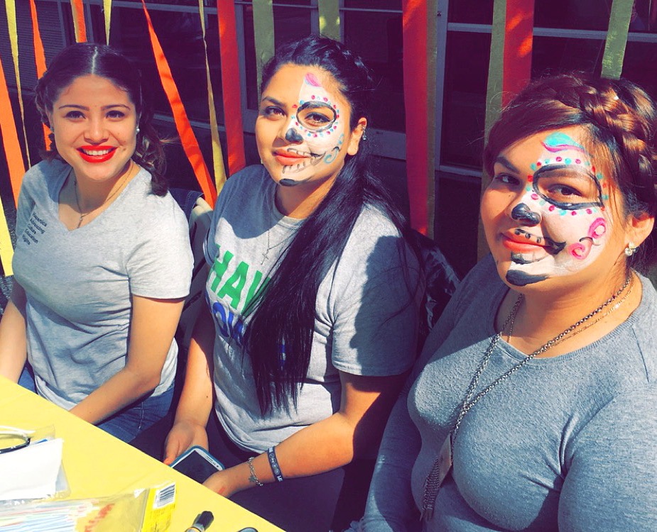 PHOTO: Andrea Velez, HACER president, Diana Portales, HACER member and Bianca Garcia, HACER officer participate in the Day of the Dead celebration.