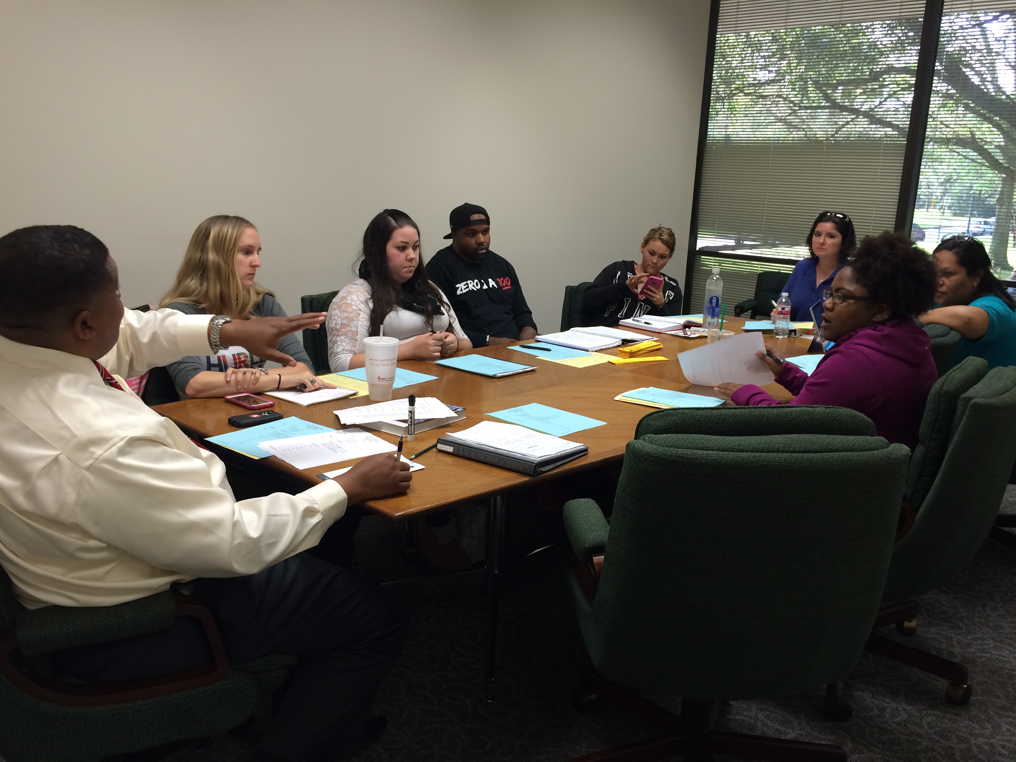Image: Everette Penn, TAPS (Teen and Police Service) co-founder and UHCL professor of criminology, discusses upcoming objectives with UHCL student volunteers during a TAPS meeting Monday, Nov. 1, 2015. Photo by The Signal reporter Lana Donath.
