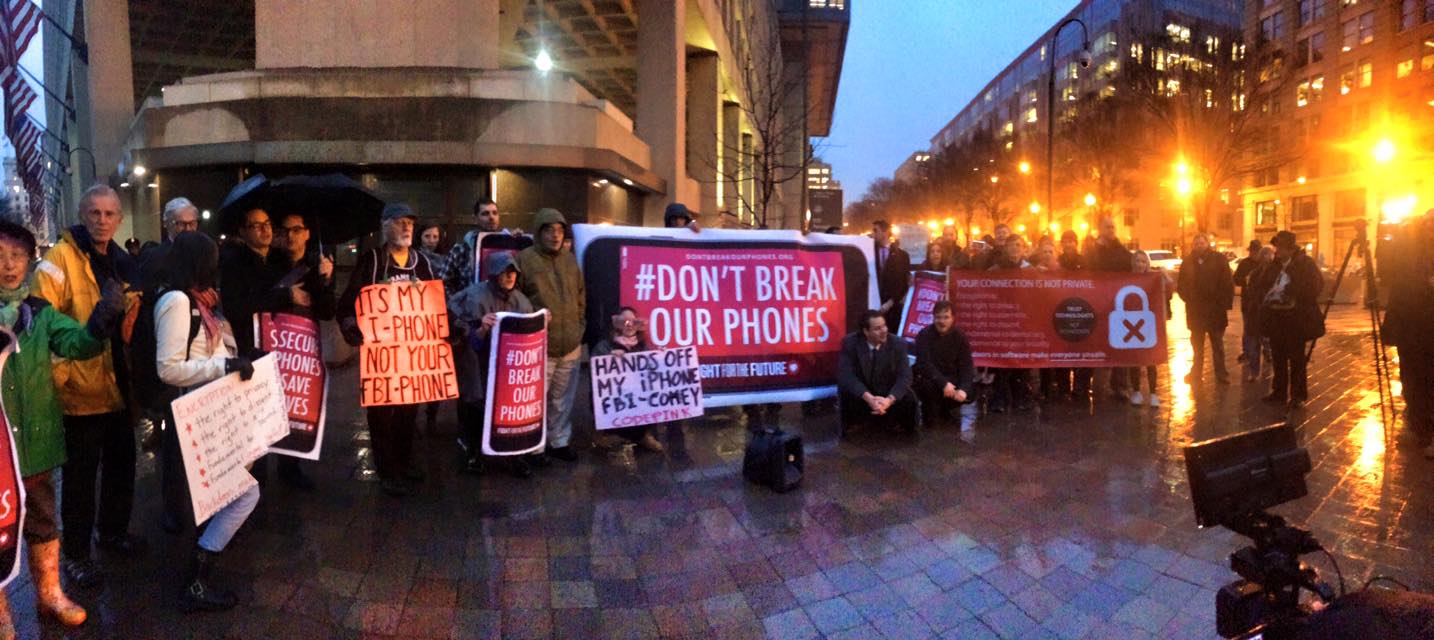 Photo: Rally participants hold signs outside of Apple Store as part of the #DontBreakOurPhones movement. Photo courtesy of Fight For The Future.
