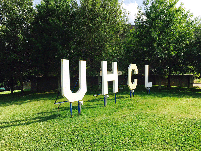 The UHCL sign at 'Hawk' Hill between the Bayou Building and SS building