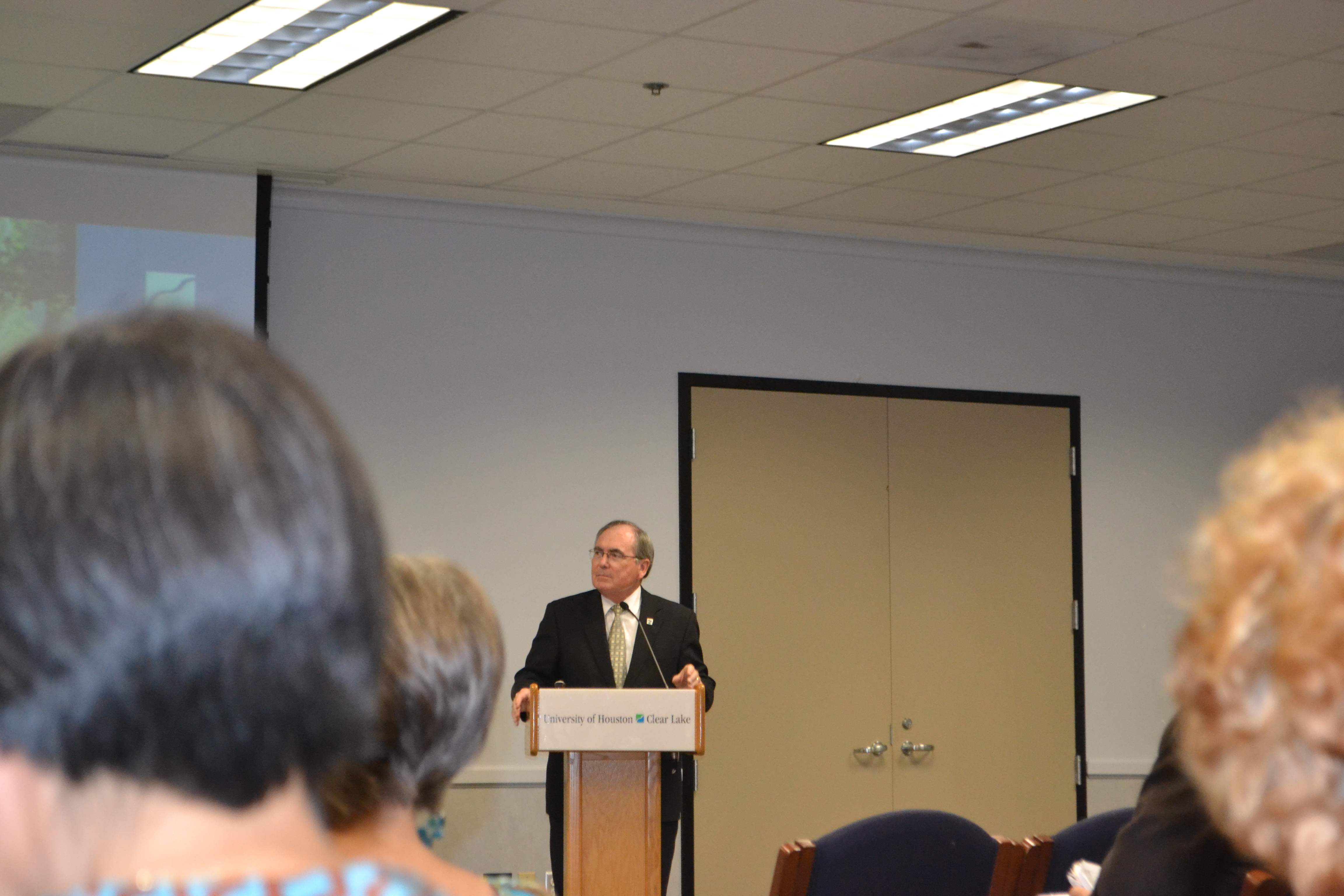 Photo: President Staples speaking at the campus-wide meeting held Sept. 15, 2016 in the Garden Room at UHCL. Photo by The Signal Reporter, Kate Gaddis.