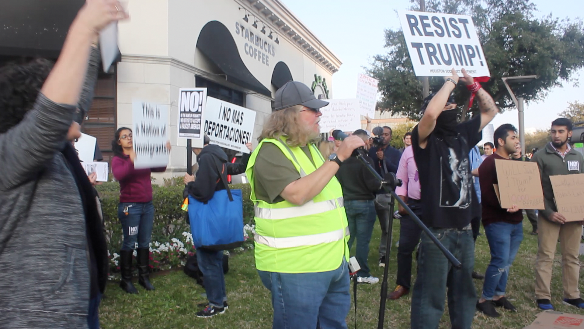 PHOTO: David Smith, Houston Socialist Movement, leads "No ban, No wall!" protest. Screenshot by The Signal reporter, Edwin Vega