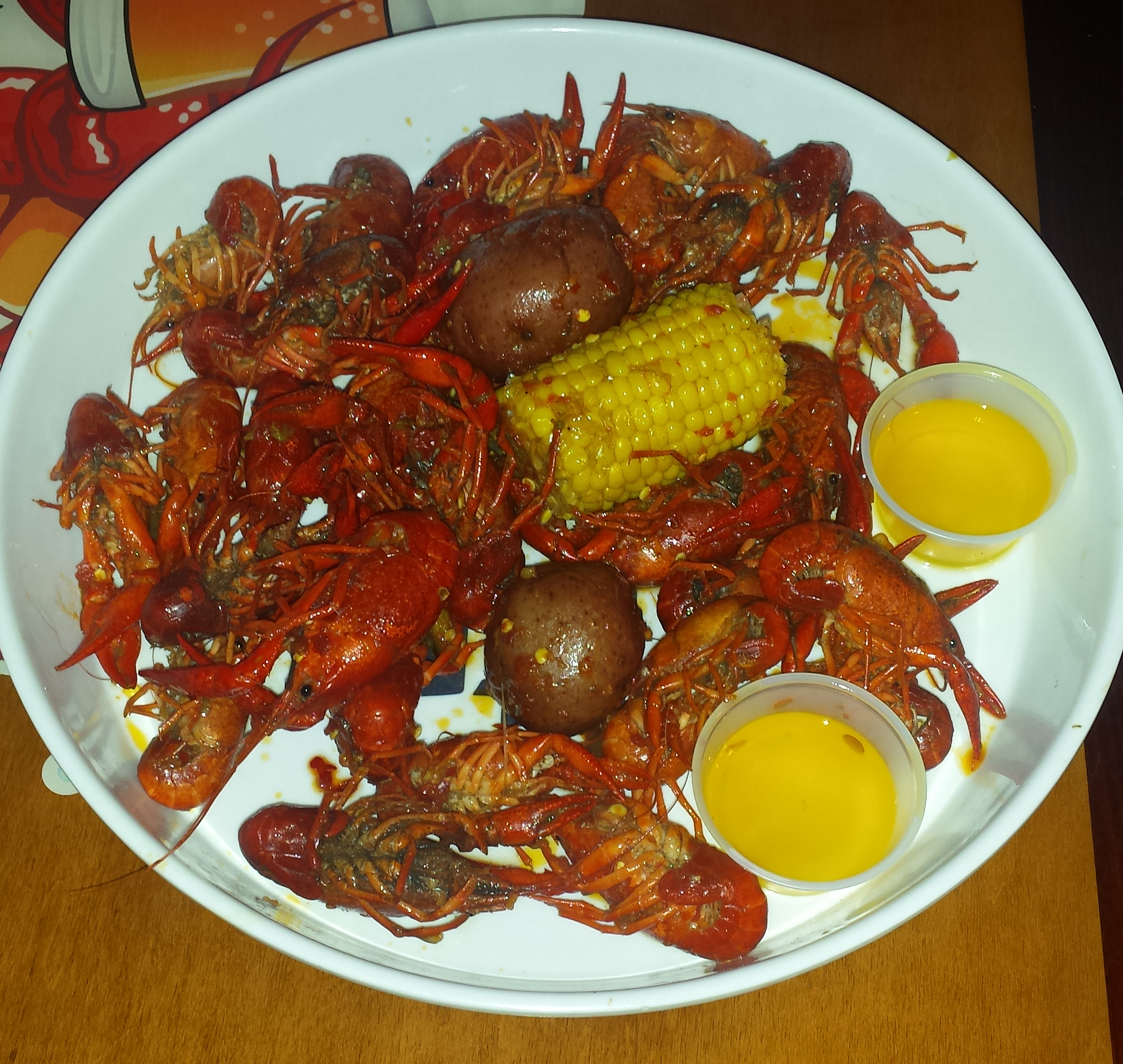 PHOTO: Spicy crawfish, melted butter, potatos, and corn are popular combinations for crawfish this season. Photo by The Signal reporter Aina Alleyne.