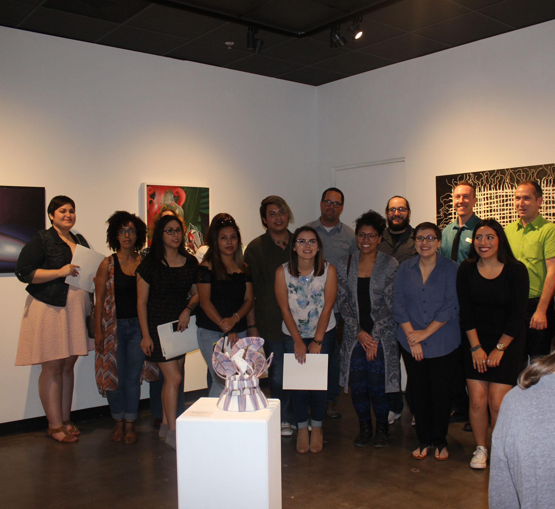 PHOTO: The 20 featured artists show off their work at the BFA Exhibition at the UHCL Art Gallery. Photo by The Signal reporter Donada Fortner.