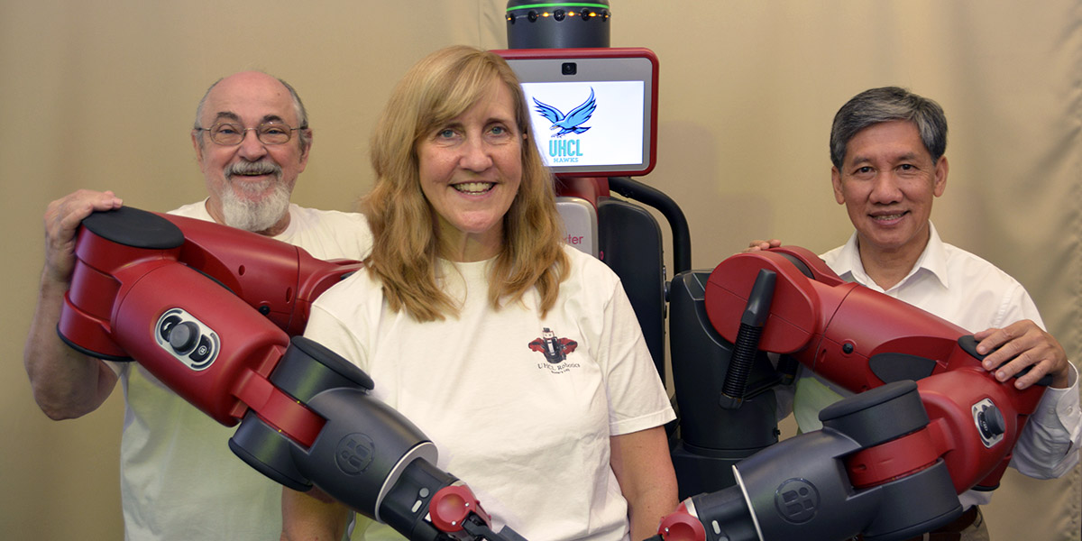 Photo: University of Houston-Clear Lake is launching the Center for Robotics Software, a collaborative effort between academic and industry partners involved in the advancement of robotics. Pictured above (l-r) is Center Director Thomas L. Harman, professor of Computer Engineering and chair of the Engineering Department, Co-Director and UHCL Visiting Researcher Carol Fairchild and Assistant Professor of Computer Engineering Luong Nguyen, who is faculty adviser to UHCL’s swarm-robotics team in NASA-hosted competitions. Photo courtesy of the Office of University Communications.