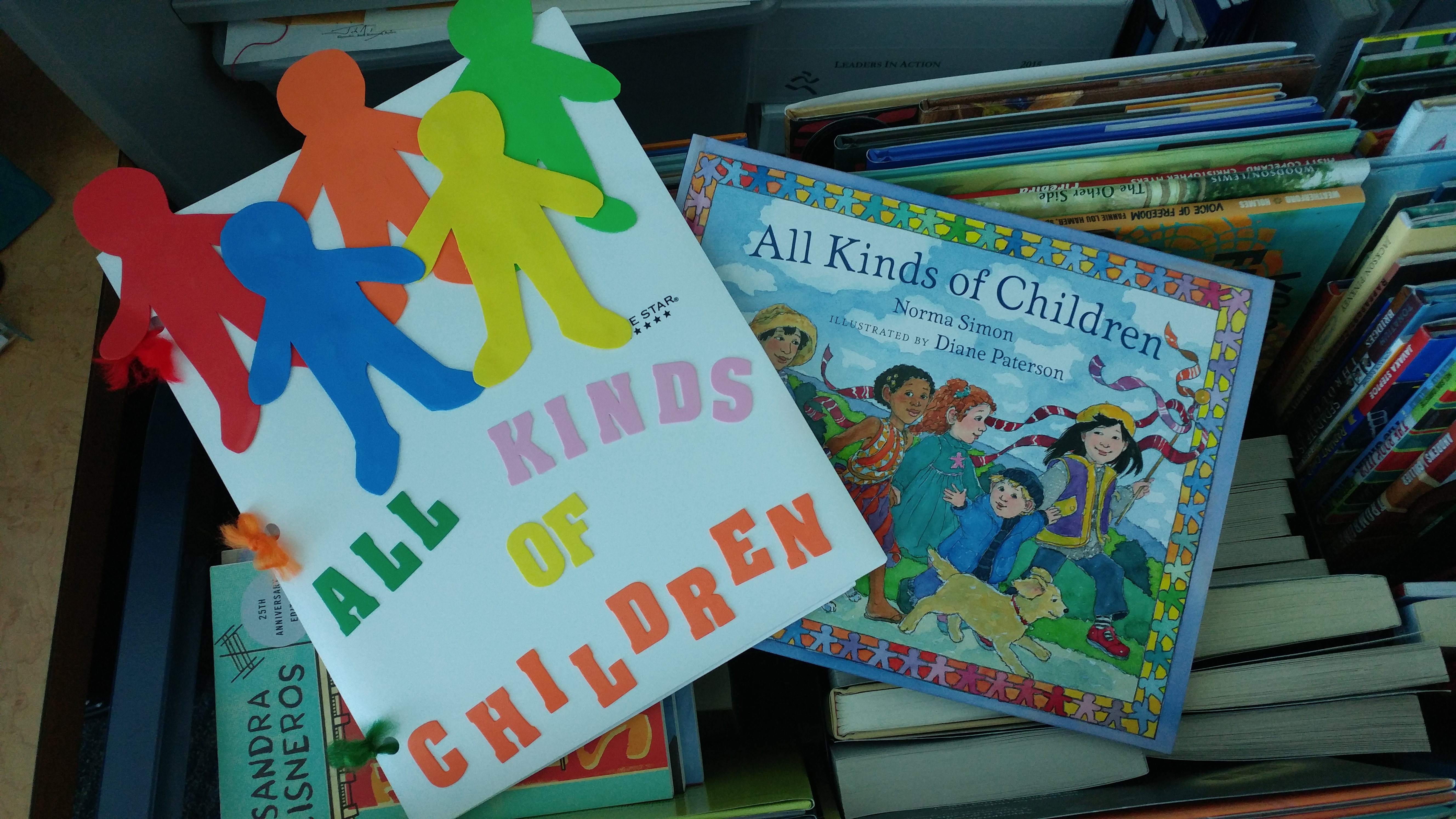 "All Kinds of Children" and the companion workbook made by UHCL students. Photo by The Signal reporter Leif Hayman.