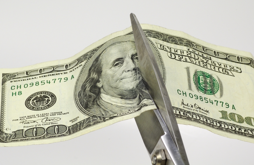 PHOTO: Hundred dollar bill being cut by scissors. Photo courtesy of Getty Images. CORRECTION: 08/29/19 - This image's attribution has been corrected.