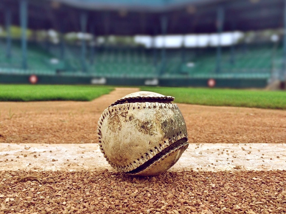 PHOTO: A worn down baseball on a baseball field. Photo courtesy of creative commons.