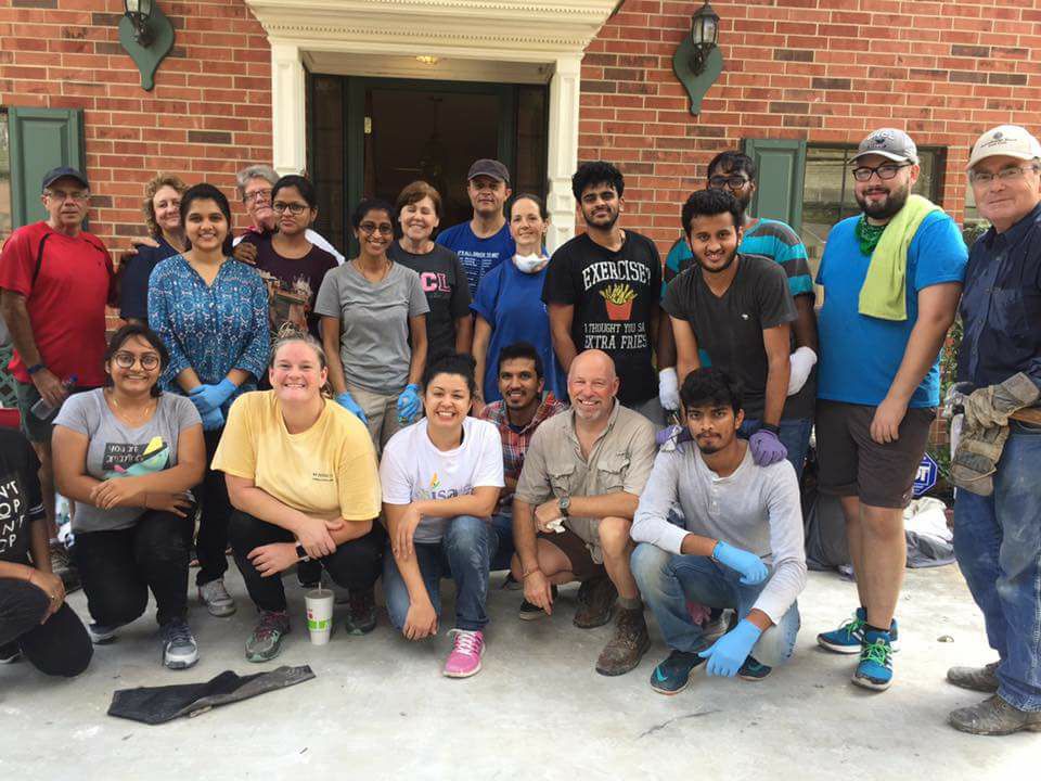 PHOTO: UHCL's Indian Student Association, along with other students, faculty and staff, volunteering at a fellow UHCL employees house during Hurricane Harvey. Photo courtesy of Raj Vadhi, president of the Indian Student Association.
