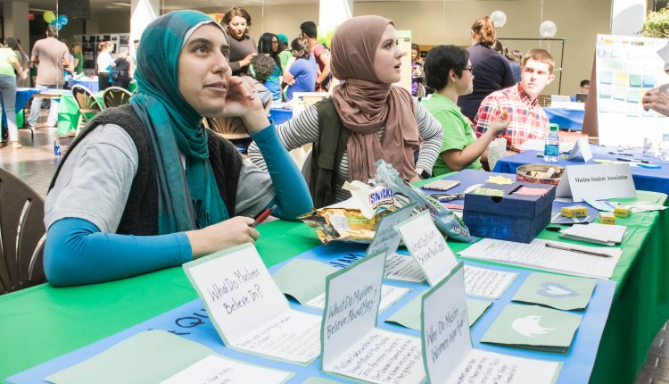 Members of Muslim Student Association, Yasmeen El-Rasheedy (left) and Lauren LeDuc (right), host a booth at the 2017 I Heart UHCL Day event. Photo by Audience Engagement Coordinator Regan Bjerkeli.