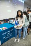 Sonia Tandel, computer science major and member of Green Hawks, holding her prize during the 2017 Bingo and Breakfast event. Photo by Audience Engagement Coordinator Regan Bjerkeli.