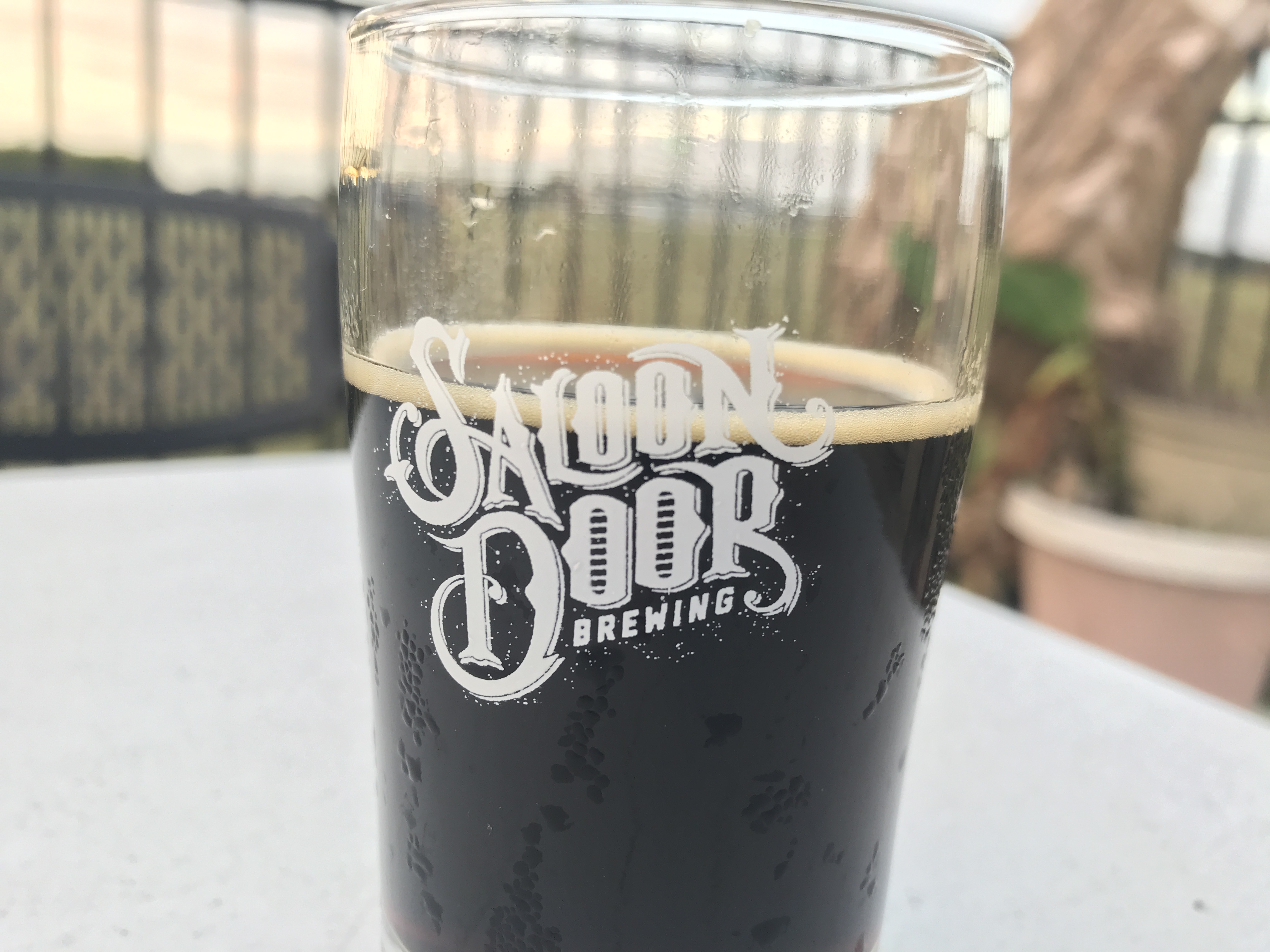 PHOTO: The "Tasty AF" Peanut Butter and Chocolate taster beer from the flight sampler offered at Saloon Door Brewing. Photo by the Signal Reporter, Alex Petty.