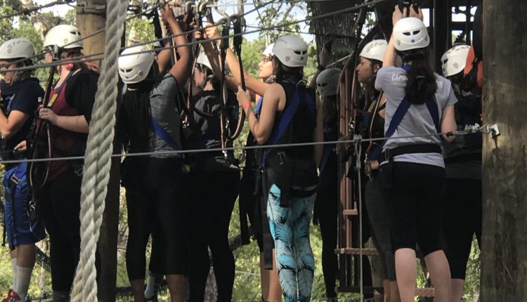 After making it to the main platform, the students from the leadership retreat decide which obstacle course to go on next. Photo courtesy of Diveanne Martinez, SGA Vice President - Committee Coordinator.