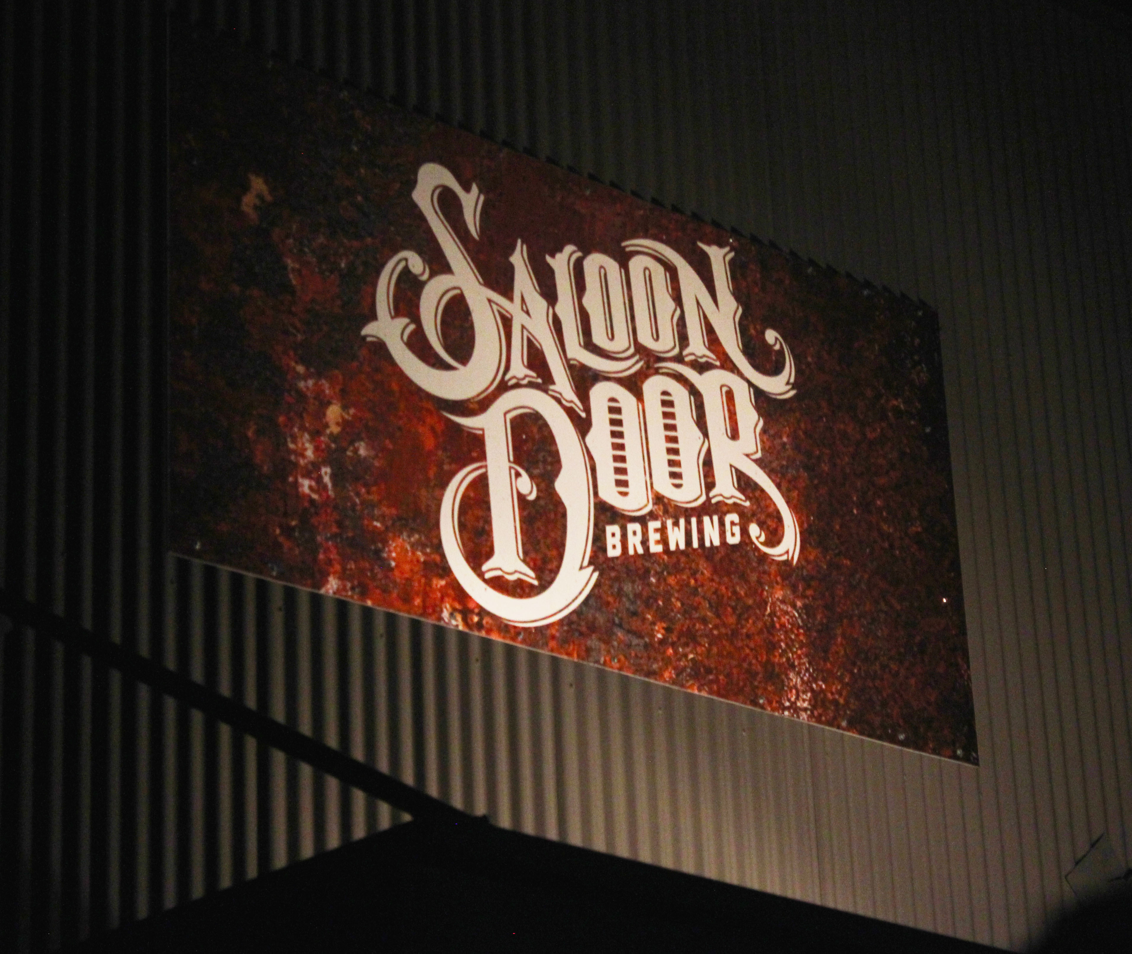 PHOTO: Saloon Door Brewing sign lighting up the night. Photo by The Signal reporter Joseph Cabrera.