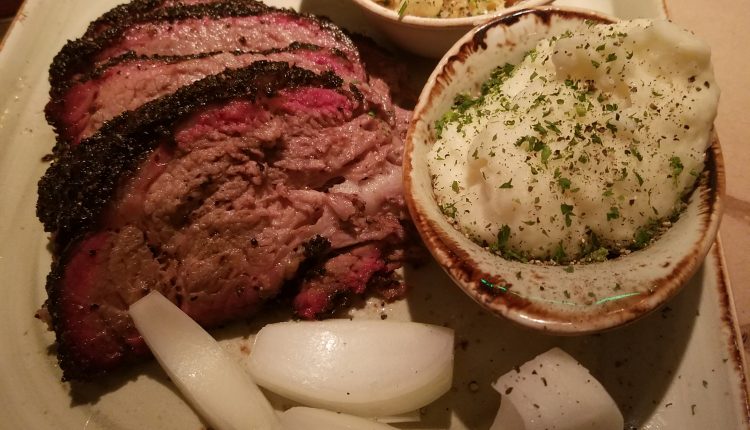Main course entree; USDA Prime Beef Brisket with a side of buttery mashed potatoes and mac and cheese. Photo by The Signal reporter Bianca Salazar.