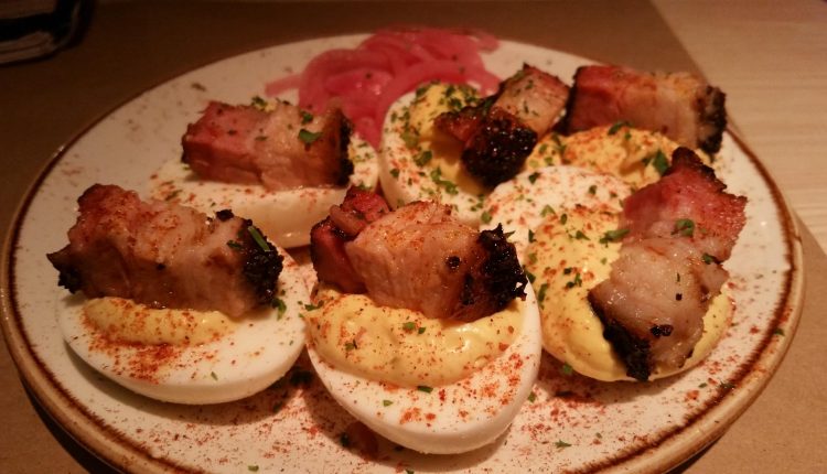 Sunday's deviled egg appetizer topped with pork belly chunks. Photo by The Signal reporter Bianca Salazar.