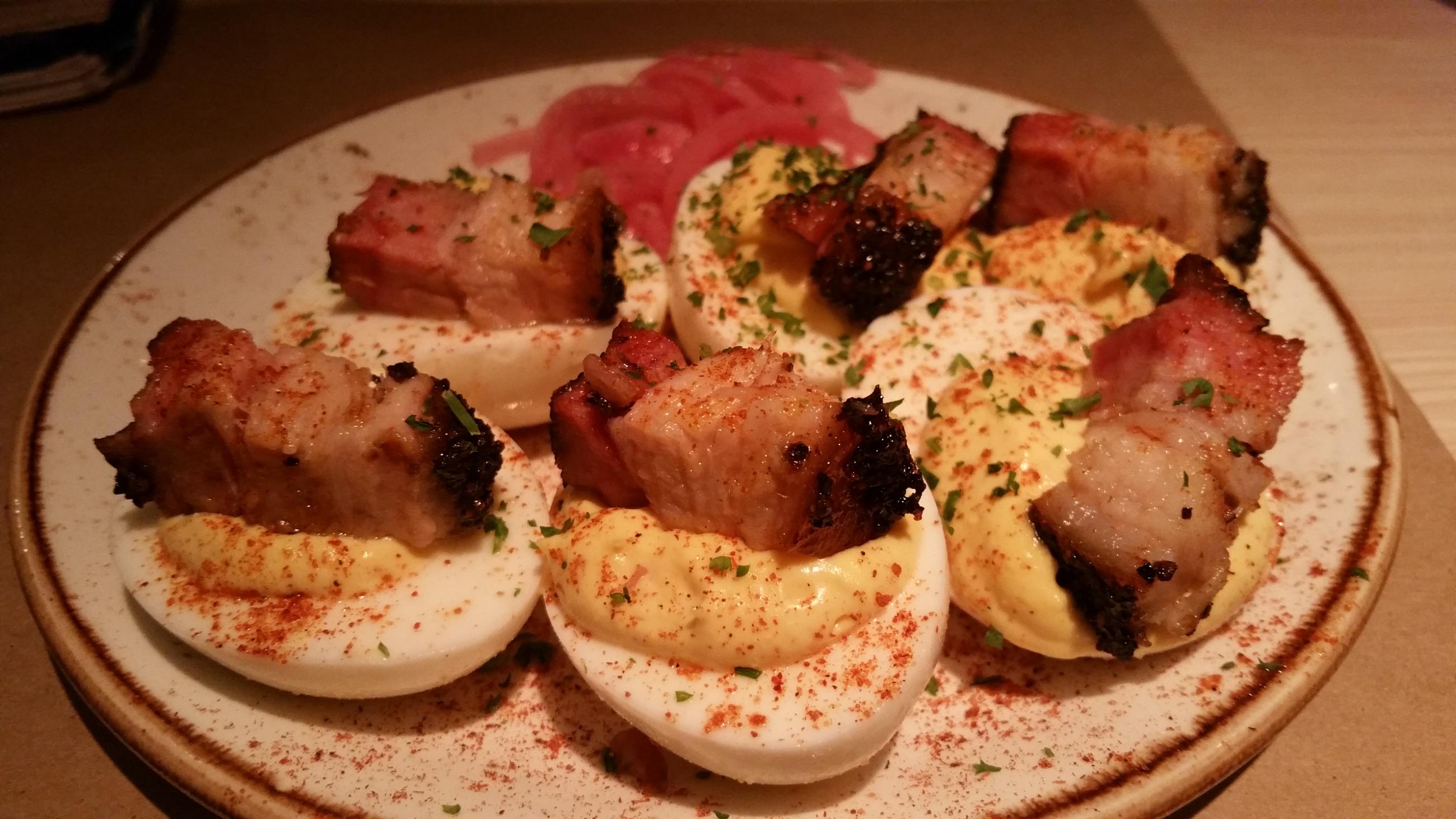 Sunday's deviled egg appetizer topped with pork belly chunks. Photo by The Signal reporter Bianca Salazar.