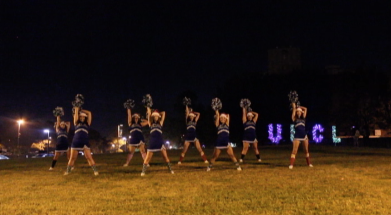 UHCL Spirit Squad dancing in front of the lit up letters. Photo courtesy of The Signal reporter Mariana Gonzalez.