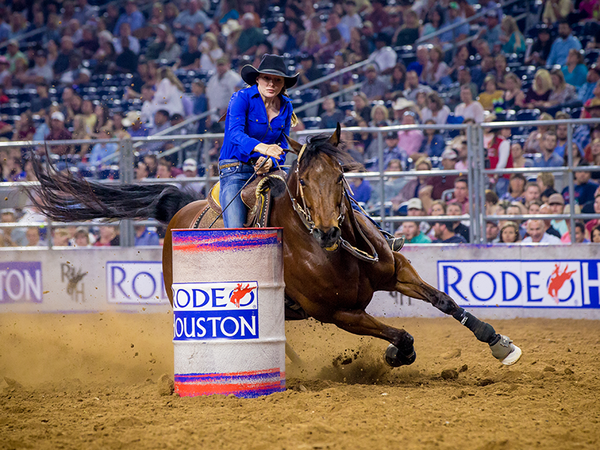 PHOTO: A woman competing in the barrel racing competition at the 2017 Houston Livestock Show and Rodeo. Photo courtesy of grupocunado.com.