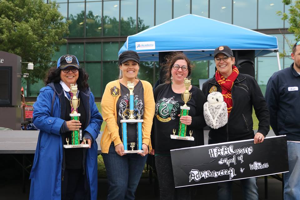 The HAACwarts School of Advisory & Wisdom team posing with their trophy for winning the 1st Place Judged Chili award.