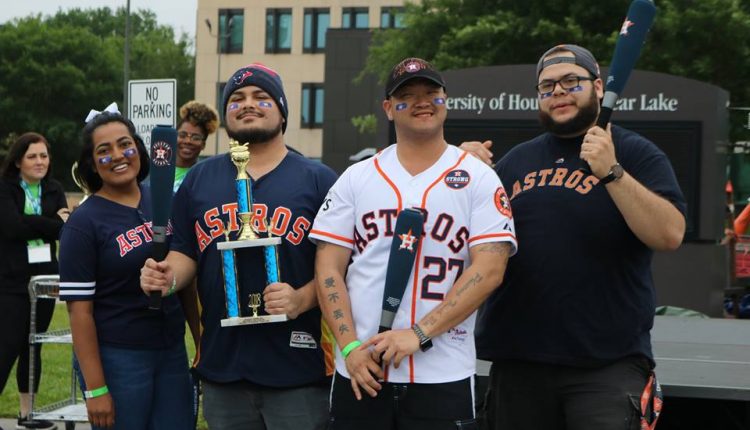 The World Series Champs team posing with their trophy for winning the 2nd Place Judged Chili award.