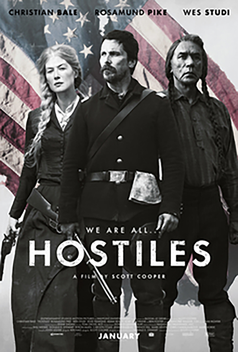 A movie poster depicting a white man, a white woman and a Native American man against an American Flag.