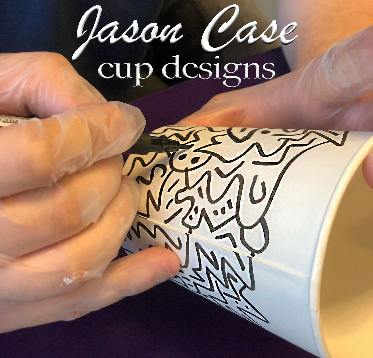 Jason Case used markers to design several cups for students to enjoy when visiting the Patio Cafe. Photo by The Signal reporter Kathryn King.