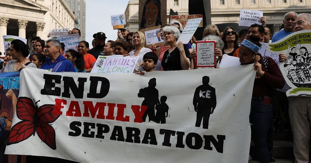 PHOTO: Protesters hold up sign reading "End Family Separation." Photo courtesy of Getty Images.