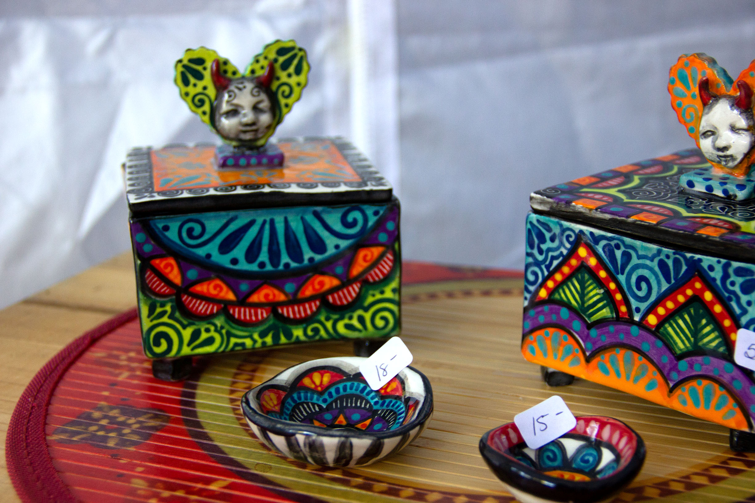 PHOTO: Traveling from San Angelo, Texas, Michelle Cuevas handbuilds functional art such as boxes, plates and cups. Cuevas also creates Dia de los muertos influneced work showing symbols of death next to colors associated with life. Photo by The Signal Online Editor Alyssa Shotwell.