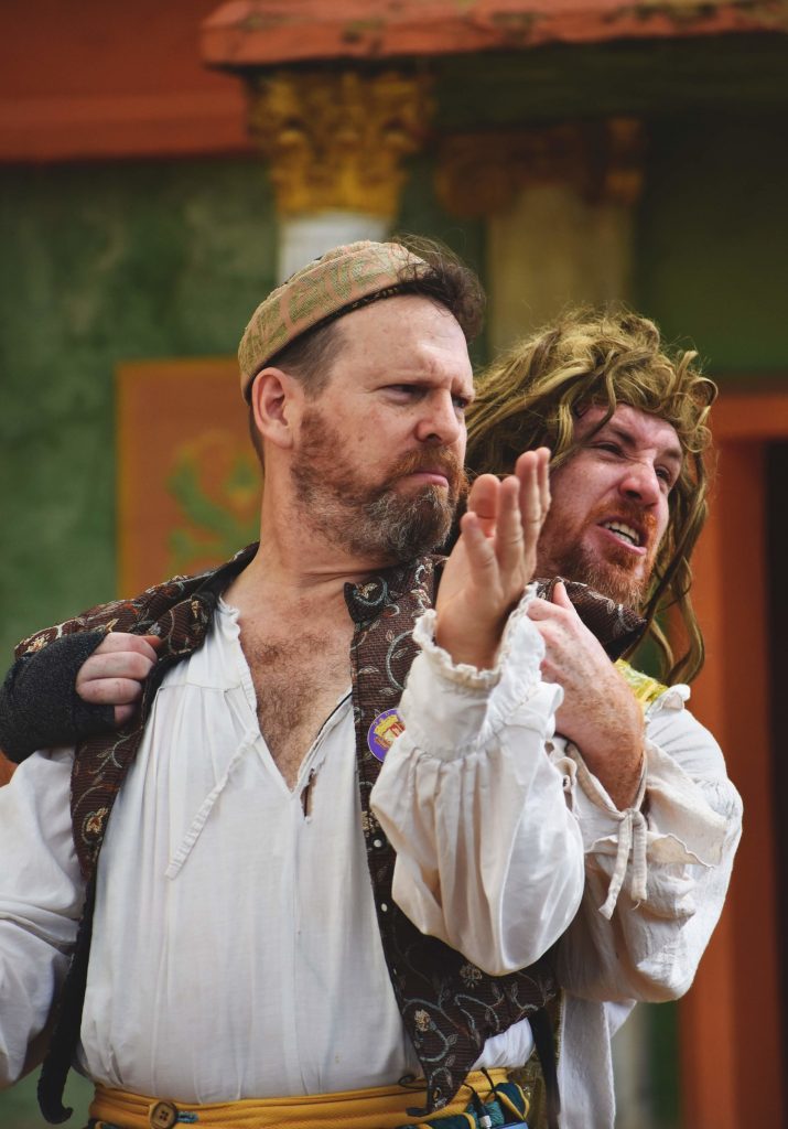 PHOTO: Comedians Patrick Hercamp and Richard Maritzer embrace during a scene in the skit “Tesaclese & Ye Sack of Rome”. Photo courtesy of Matthew Smith