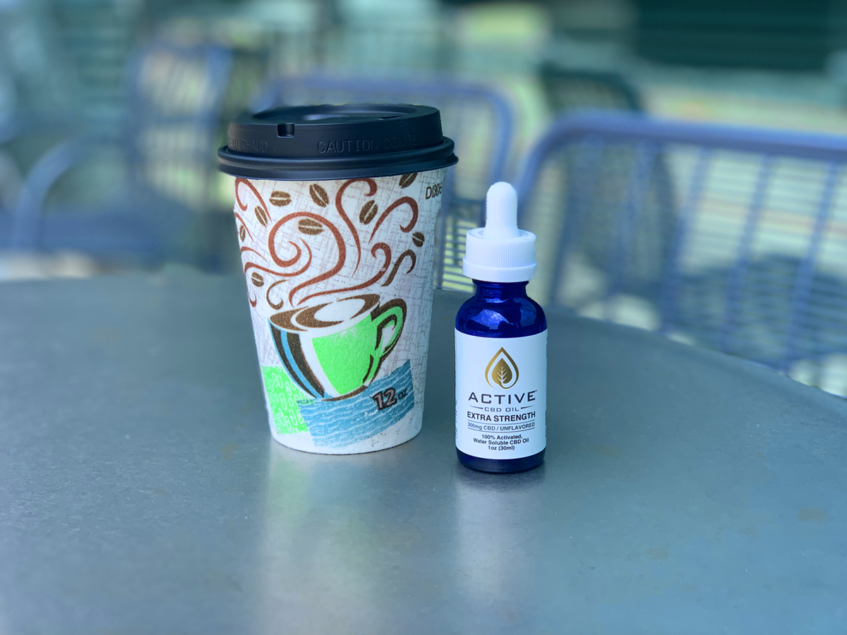 PHOTO: Coffee cup with CBD oil on cafe table Photo by The Signal reporter Madison Collins.