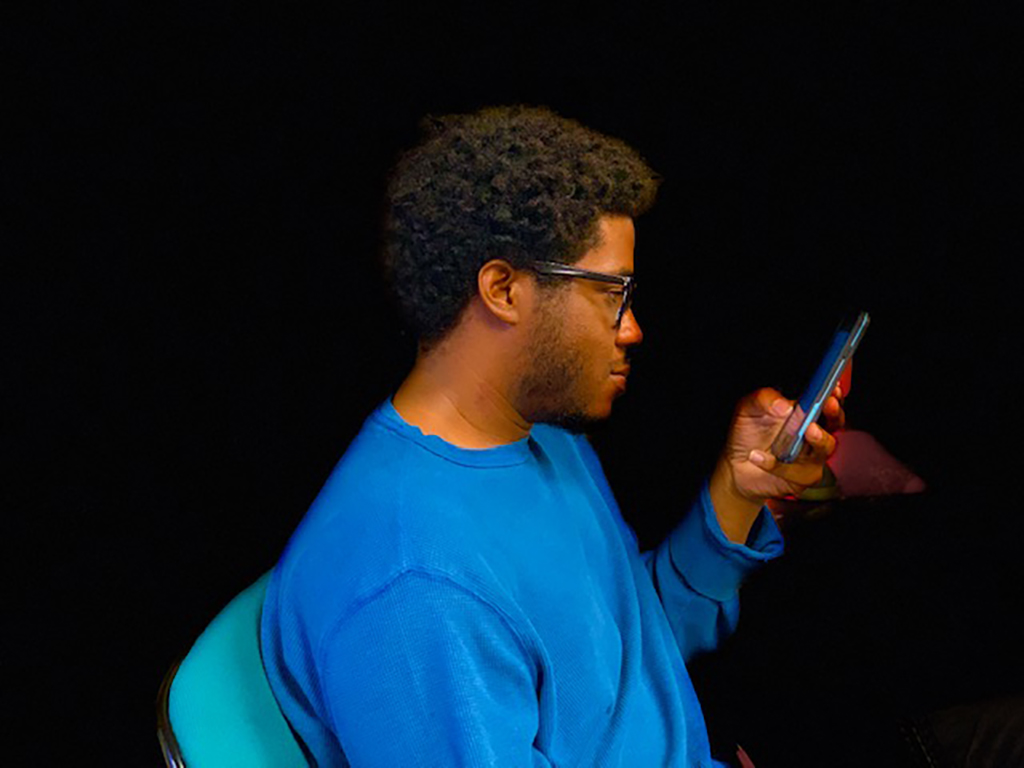 Student Troylon Griffin II using an app on a smart phone device. Photo by Samantha Sincox
