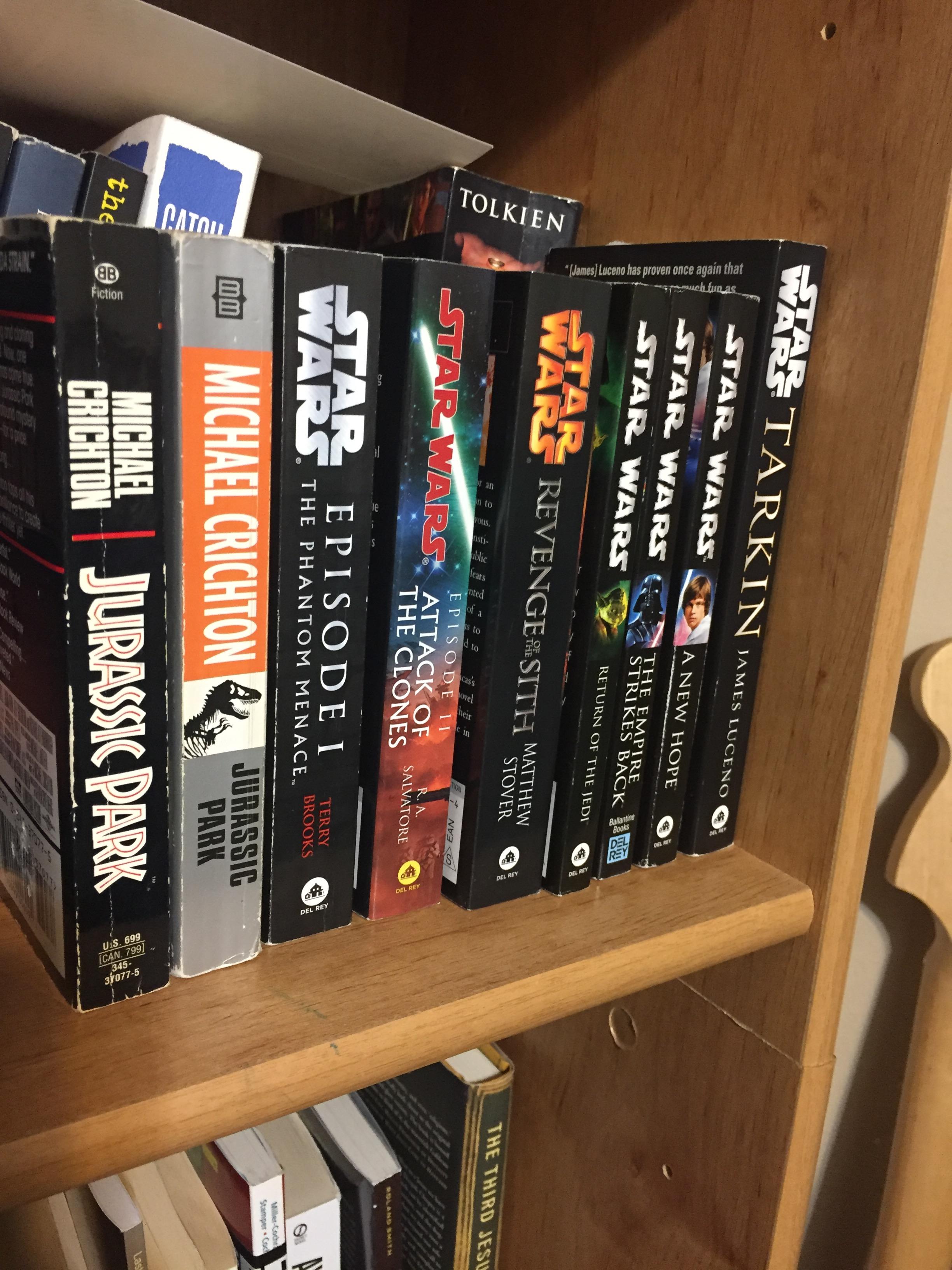 PHOTO: Image showing two copies of the novel "Jurassic Park" as well as multiple "Star Wars" novelizations and books. The books are on a book shelf among other books that can be seen in the background. Photo by The Signal managing editor Troylon Griffin II.