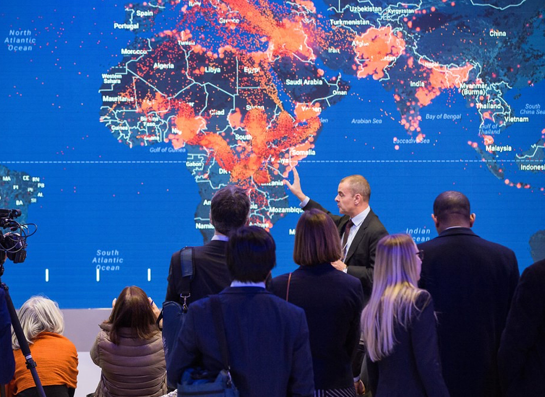 PHOTO: Leaders meeting in front of a map at World Economic Forum 2017. Photo courtesy of World Economic Forum / Christian Clavadetscher via Flickr.