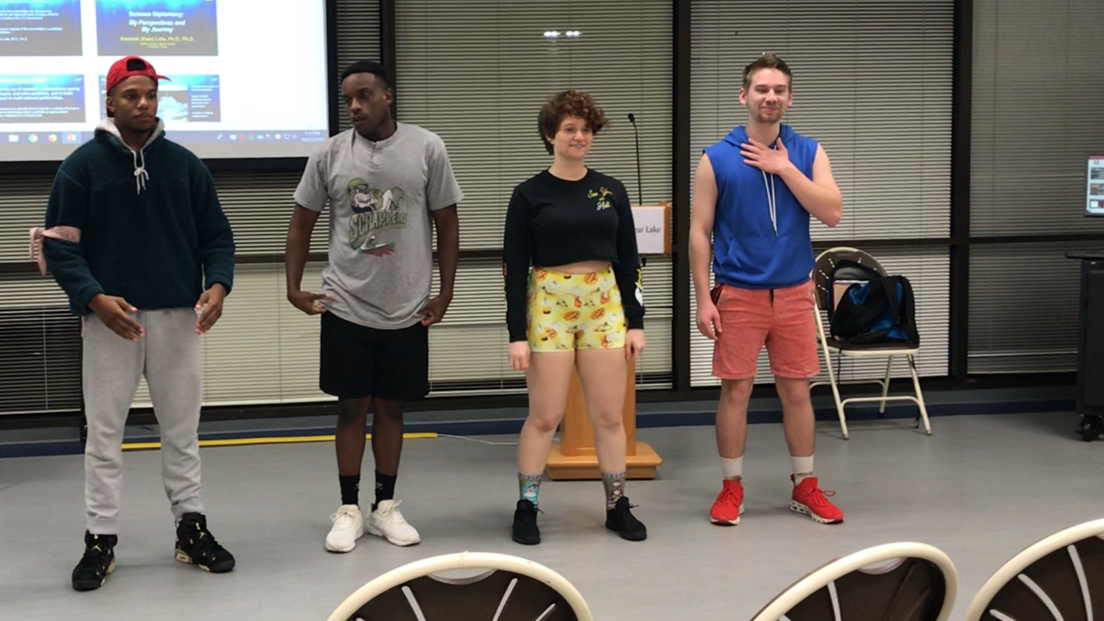 PHOTO: Four cast members of UHCL Storytellers production "Kill Mii" stand side-by-side during show rehearsal. Photo courtesy of UHCL Storytellers
