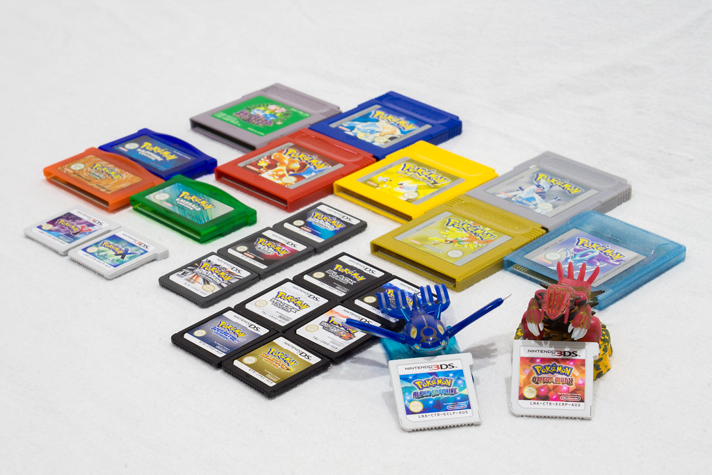 PHOTO: "Pokemon ORAS, Welcome to the Family!" shows several different Pokémon on a white table. Photo courtesy of eigthth Purves (S3ISOR) in the Creative Commons.: