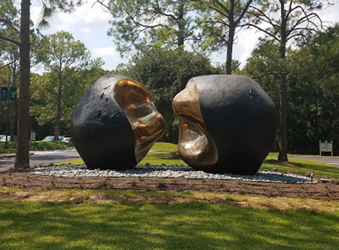 PHOTO: Artist Pablo Serrano’s 1977 “Spiritus Mundi,” also known as the Kissing Stones, resides outside the front entrance to the Bayou Building. This sculpture welcomes students, faculty, staff and visitors to the university. Photo by The Signal reporter Elizabeth Craft.