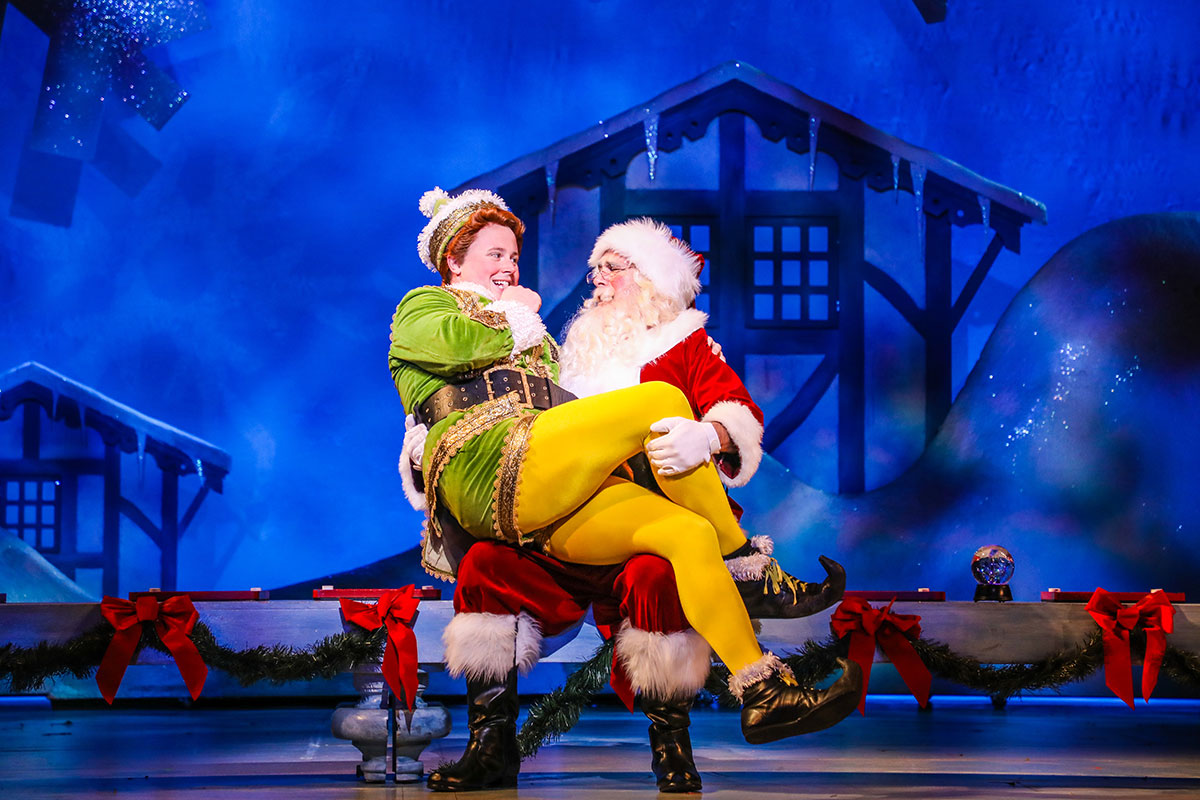 PHOTO: Quinn VanAntwerp as “Buddy” and Steven Bogard as “Santa” in the Theatre Under The Stars production of Elf - The Musical. Photo by Melissa Taylor; courtesy of TUTS.