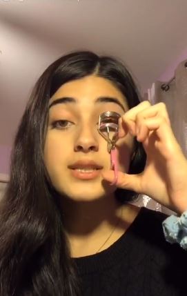 PHOTO: Afghan-American teenager, Feroza Aziz, who uses TikTok for makeup tutorials has gone viral across the web by using her platform to talk about the detention of Muslims in China. Screenshot courtesy of Tiktok. https://www.theguardian.com/technology/2019/nov/27/tiktok-makeup-tutorial-conceals-call-to-action-on-chinas-treatment-of-uighurs