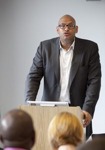 PHOTO: Former player John Amaechi speaking in 2009. Photo courtesy of Sport Business on Flickr. SOURCE: https://flickr.com/photos/38525016@N06/3542441262