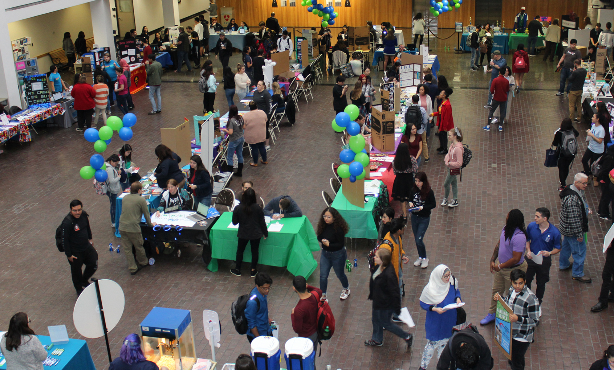 PHOTO: Student overlooks the student organization exposition from the second floor. Photo by: Signal reporter Aimee Kubena.