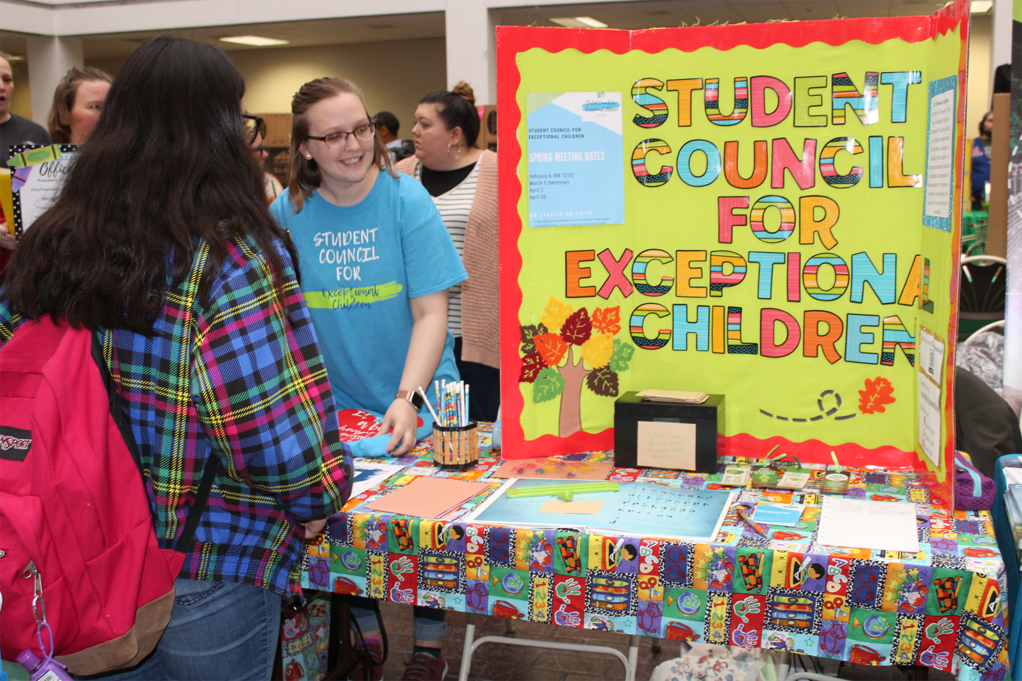 PHOTO: A representative from the student council for exceptional children talks to a student about joining their organization. Photo by: The Signal reporter Aimee Kubena.