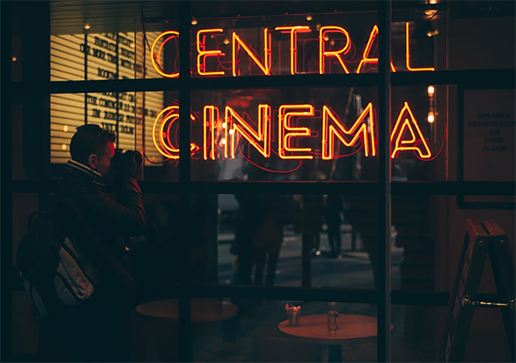 PHOTO: This is a sign that says central cinema that is hung on a mirror. Photo by Clem Onojeghuo via Pexels.com