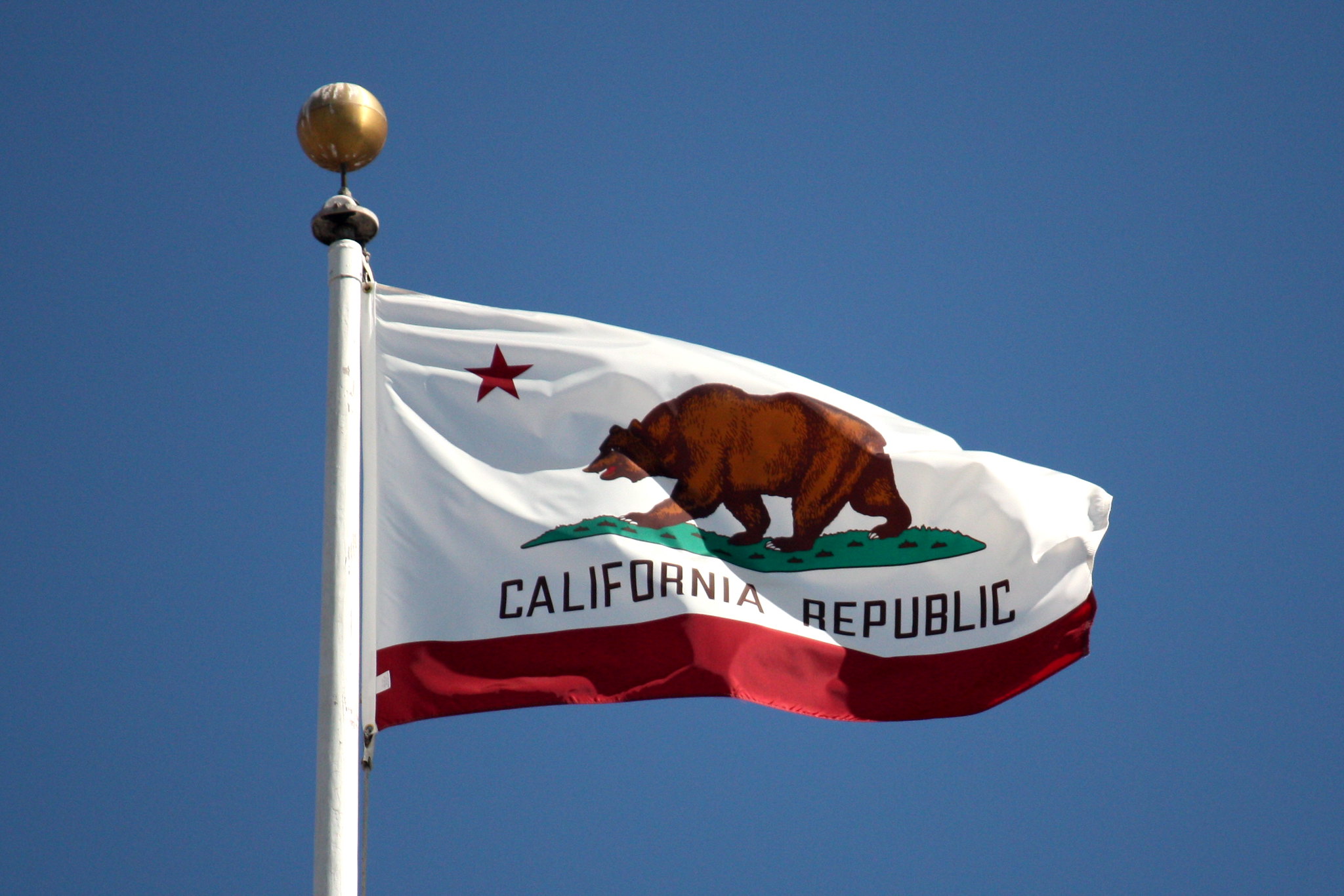 PHOTO: The flag of California features a bear and the text, "California Republic". Photo courtesy of Scazon on Flickr. SOURCE: https://www.flickr.com/photos/scazon/3055252354