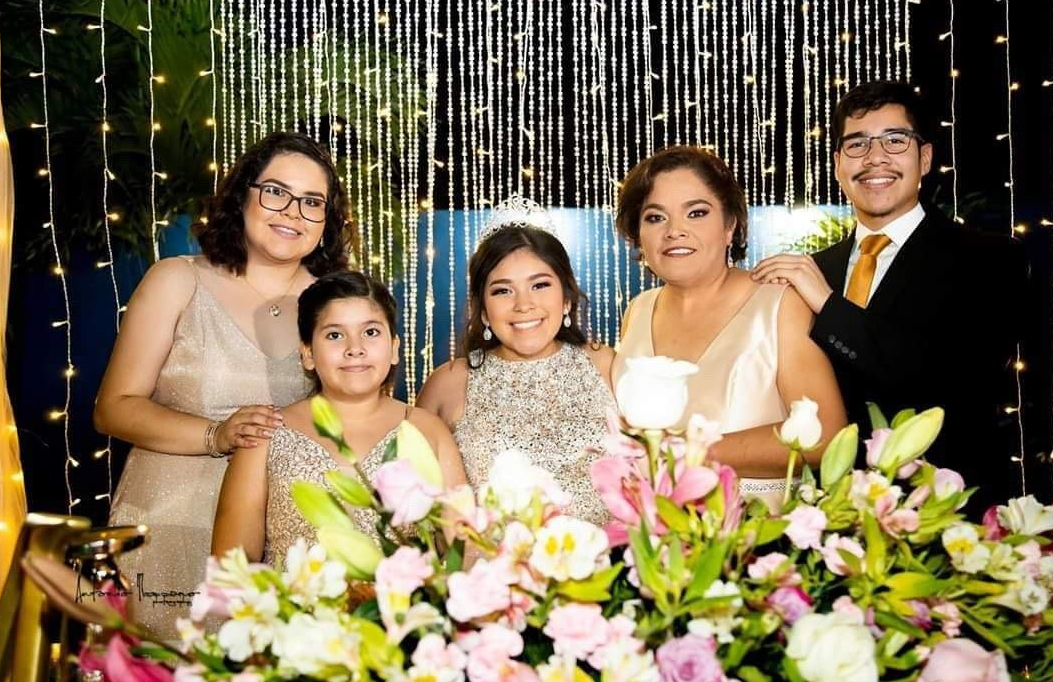 PHOTO: Flor Gonzalez with her family at her younger sisters' quinceañera. Left to right: Flor Gonzalez, Julie Rivas, Miranda Rivas, Anel Gonzalez and Marlon Gonzalez. Photo courtesy of Flor Gonzalez.
