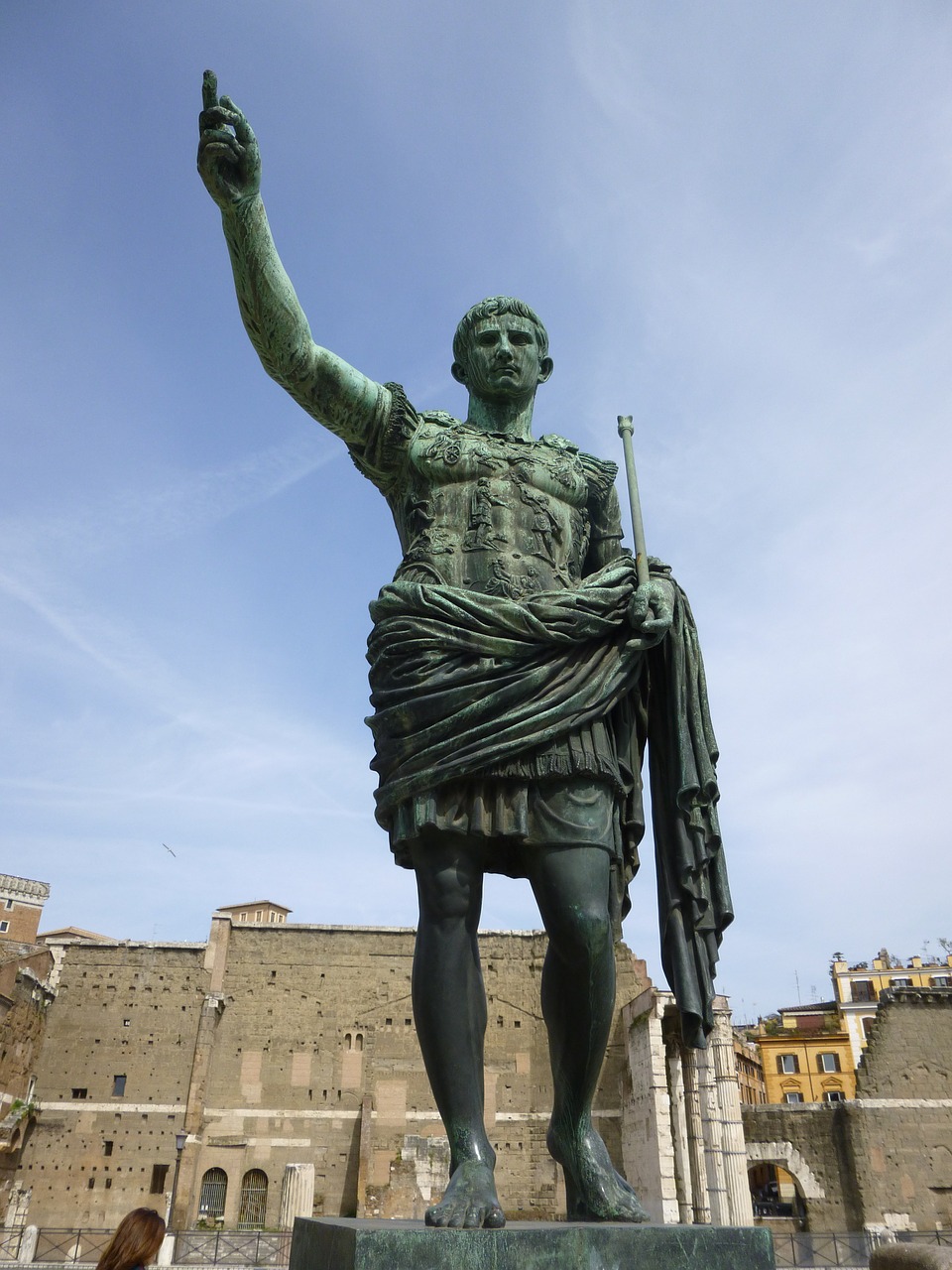 PHOTO: Photo taken from beneath a towering statue of Julius Caesar, arm outstretched toward the sky.