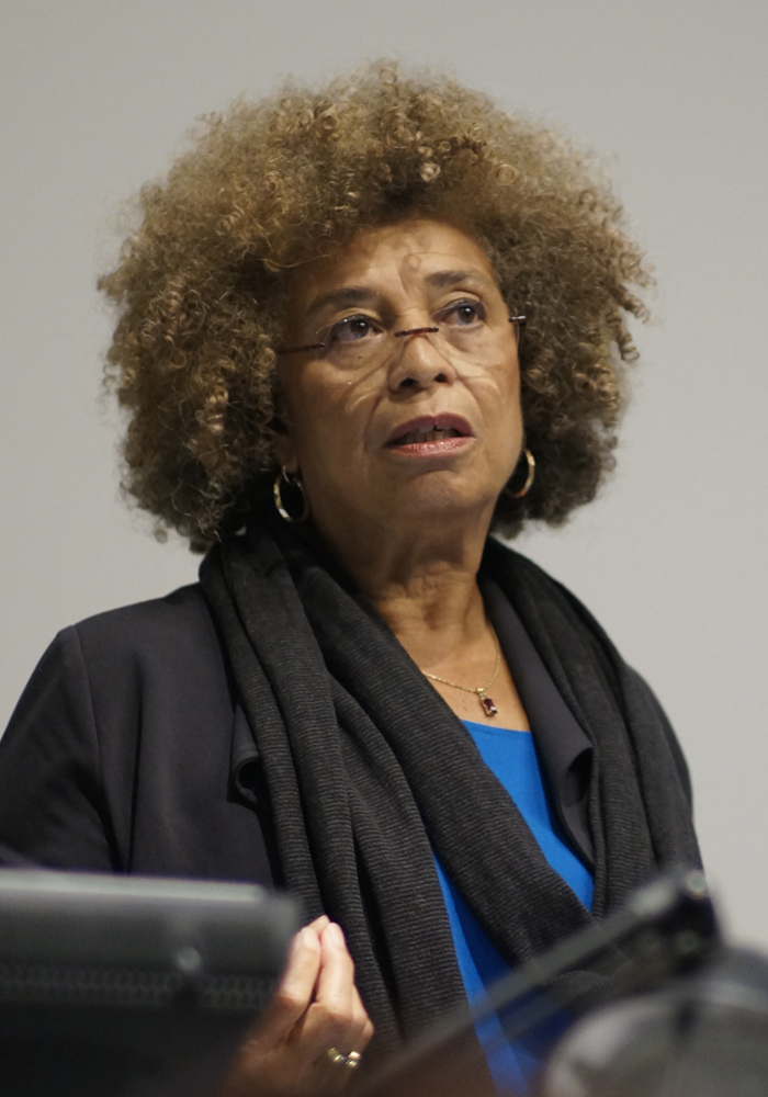 PHOTO: Angela Davis speaking at Columbia University in 2014. Photo courtesy of GSAPP on Flickr. SOURCE: https://flickr.com/photos/38426037@N04/15692286817